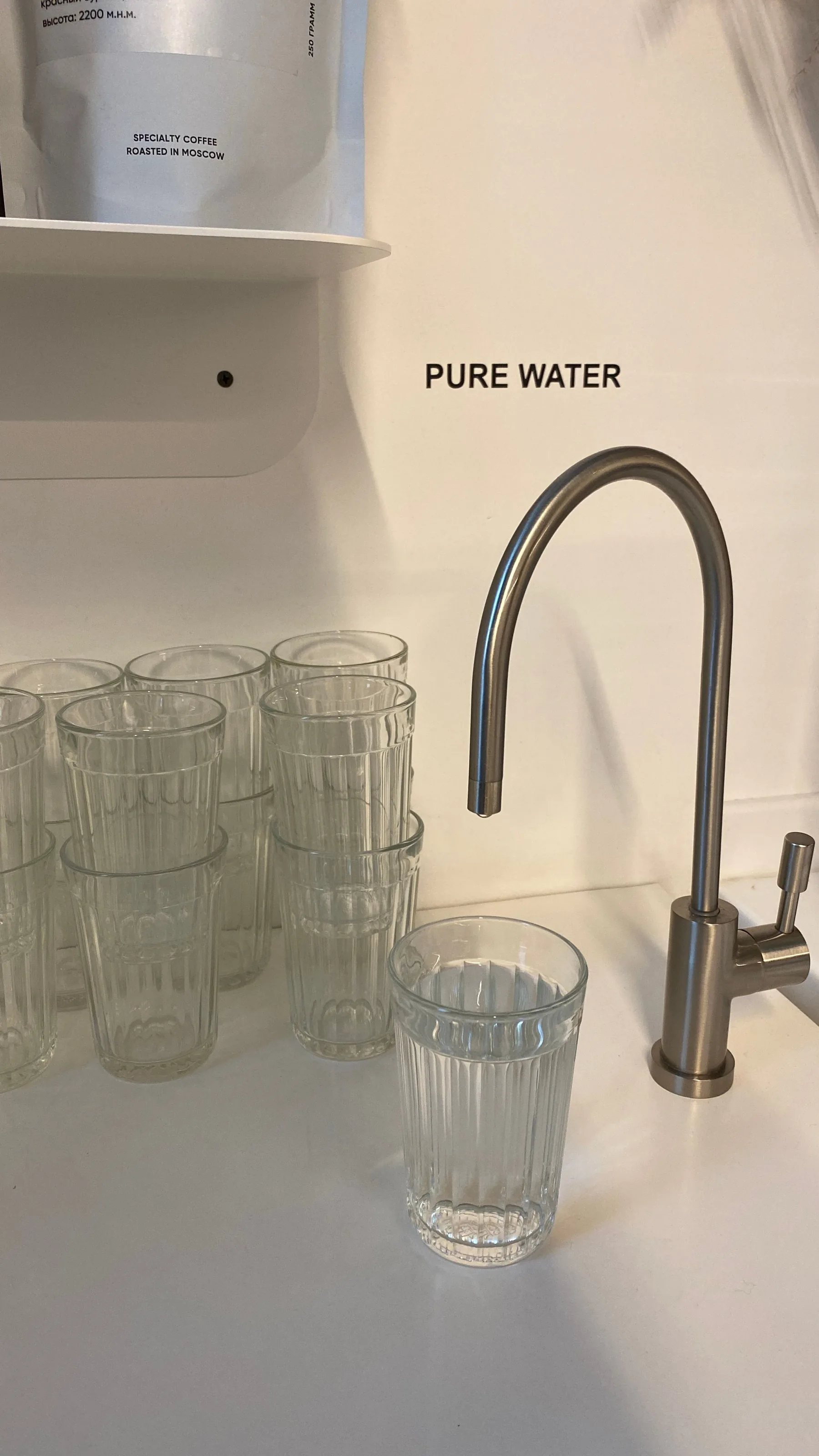 Representative drinking-water faucet and glasses